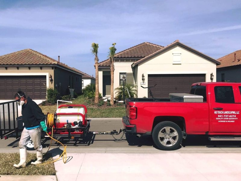 His Touch Landscaping Truck and worker